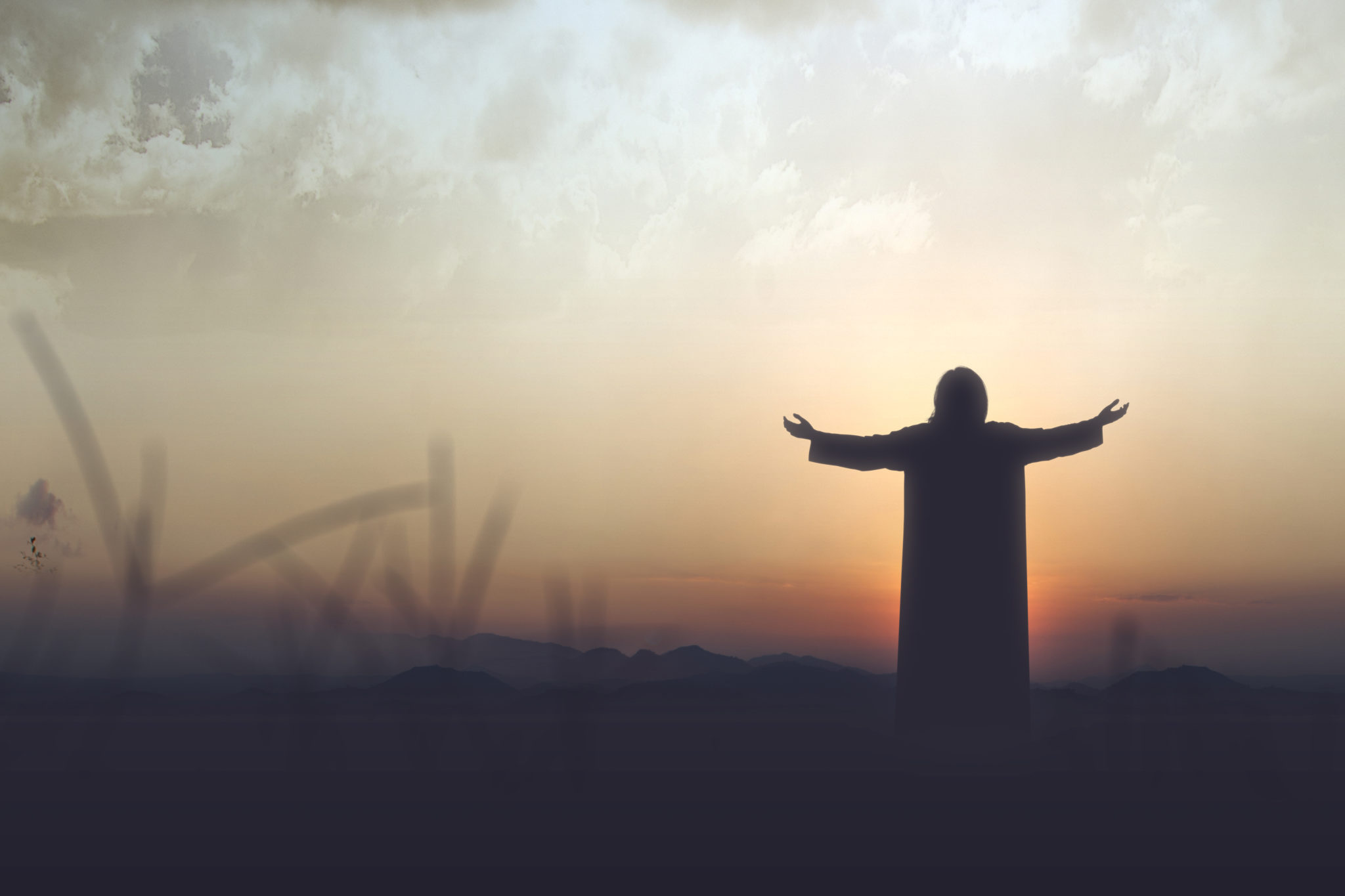 Rear,View,Silhouette,Of,Jesus,Christ,Raised,Hands,And,Praying
