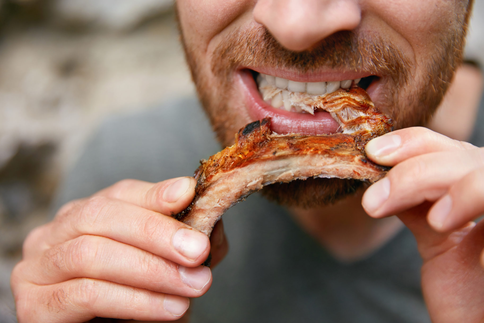 People,Eat,Food.,Man,Eating,Barbecue,Ribs,In,Grill,Bar